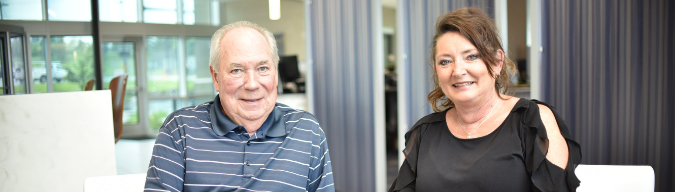 a man and a woman smiling