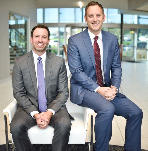 Two men smiling at camera